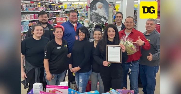 a group of ten dollar general employees posing for a photo, including a woman named emily duncan who is holding a plaque that was given to her