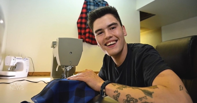 a 19 year old named wyatt miller smiling as uses his sewing machine