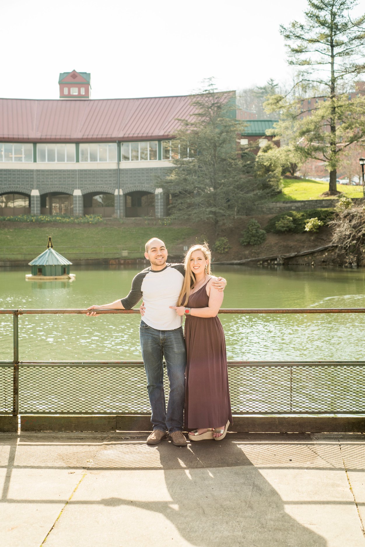 the same couple in the present in front of a body of water