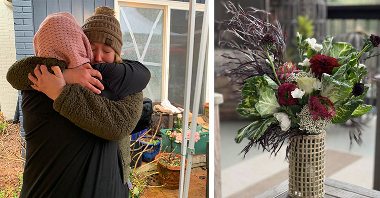 two women hugging next to bouquet of flowers