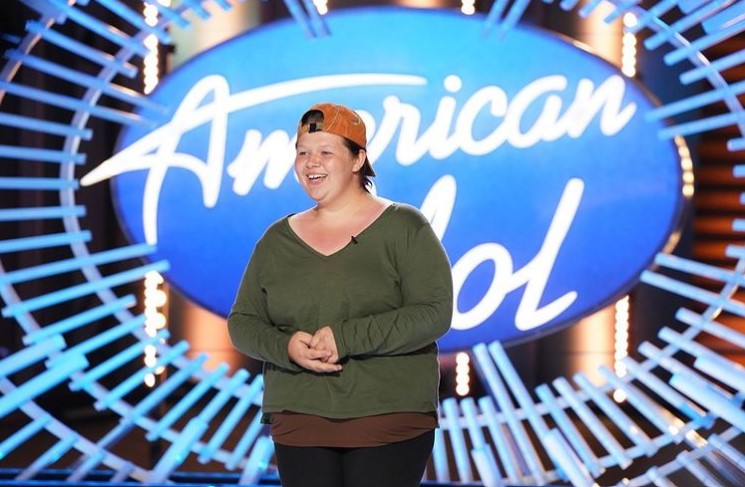 18-year-old woman named kelsie dolin smiling as she auditions for american idol