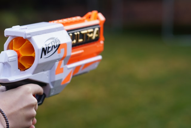 closeup of a nerf gun that's being aimed