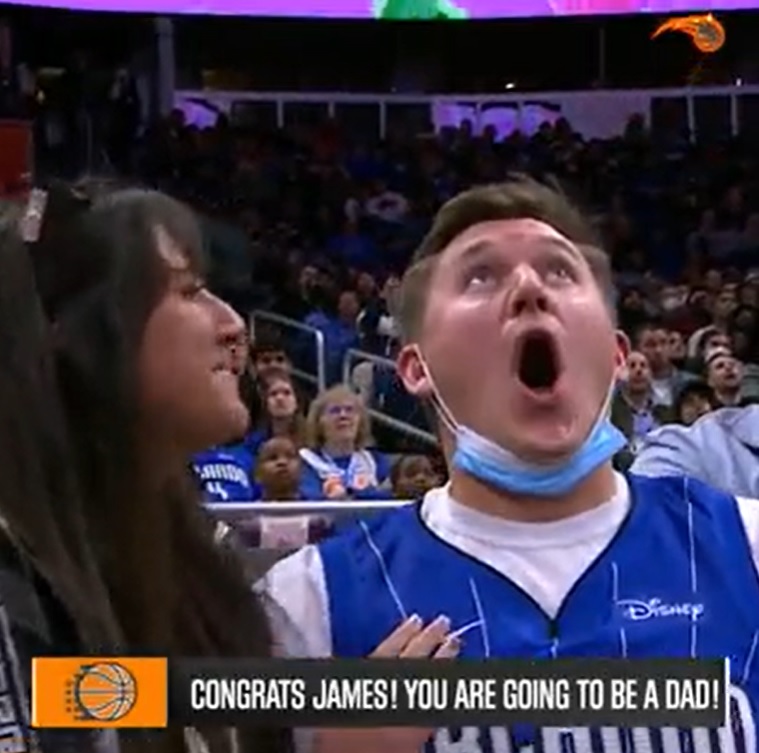 a man surprised as he learns he's going to be a dad