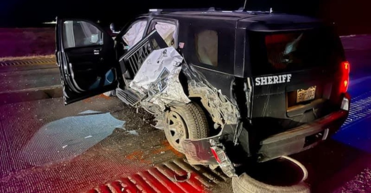 side view of a sheriff's totaled car in adams county, colorado.