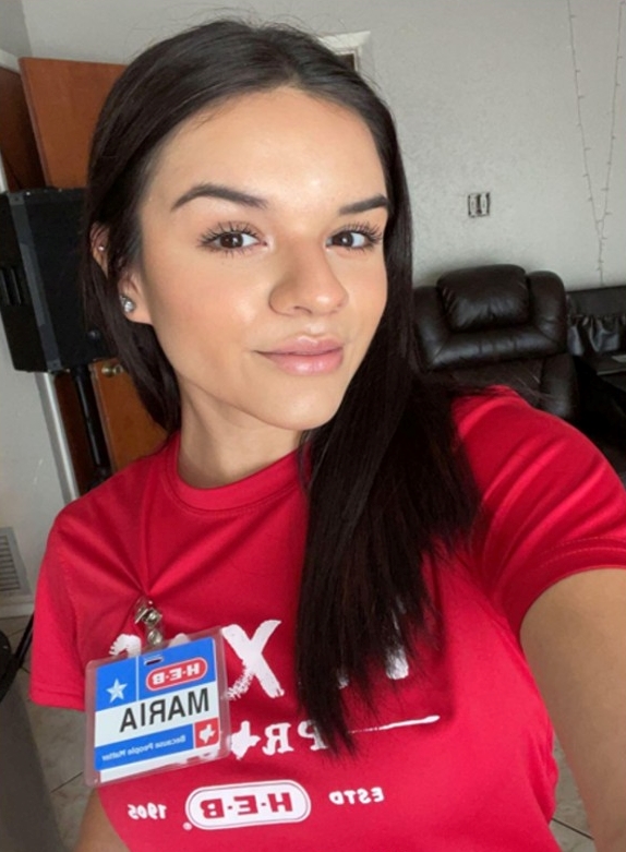 selfie of marie balboa. she is smiling and wearing her h-e-b uniform.