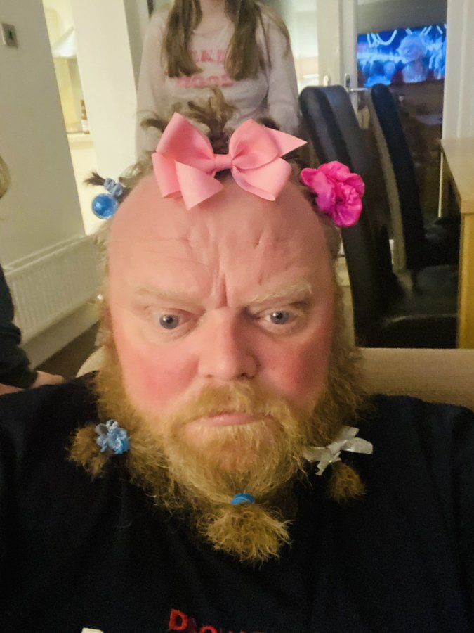 dad wearing makeup and bows