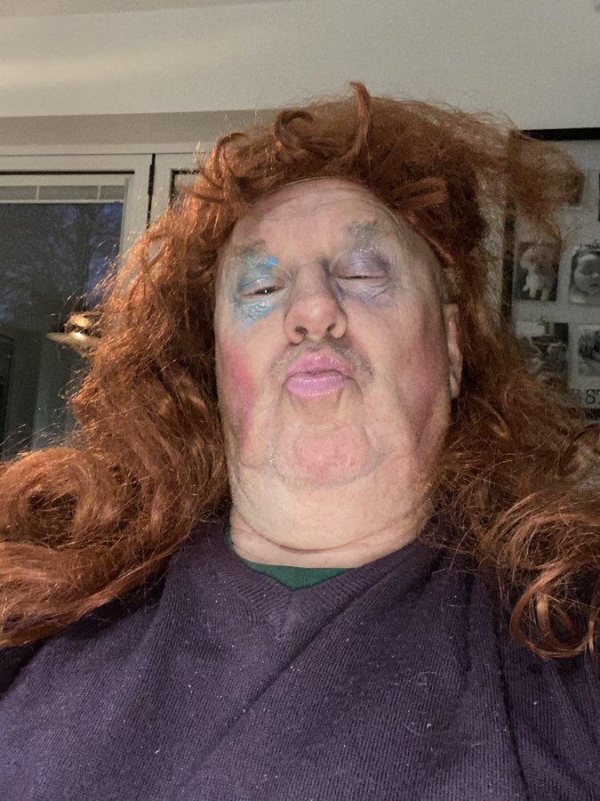 dad wearing makeup and a wig.