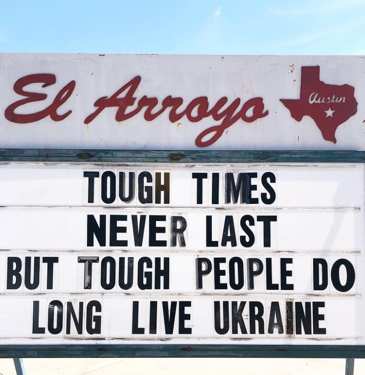 el arroyo marquee that reads "tough times never last but tough people do long live ukraine."
