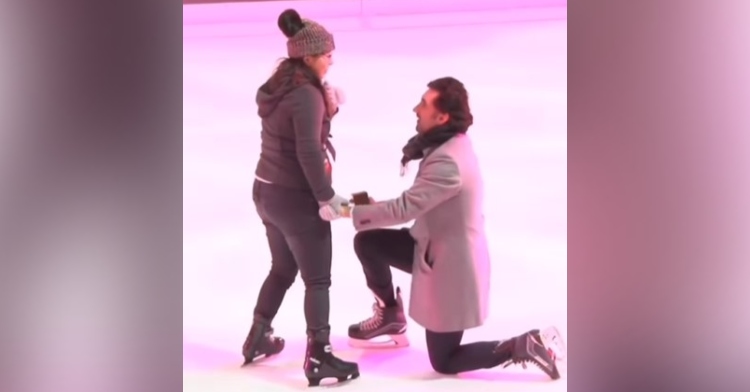 a hockey player named sean on one knee at the ice rink at rockefeller center to propose to his girlfriend, christine.