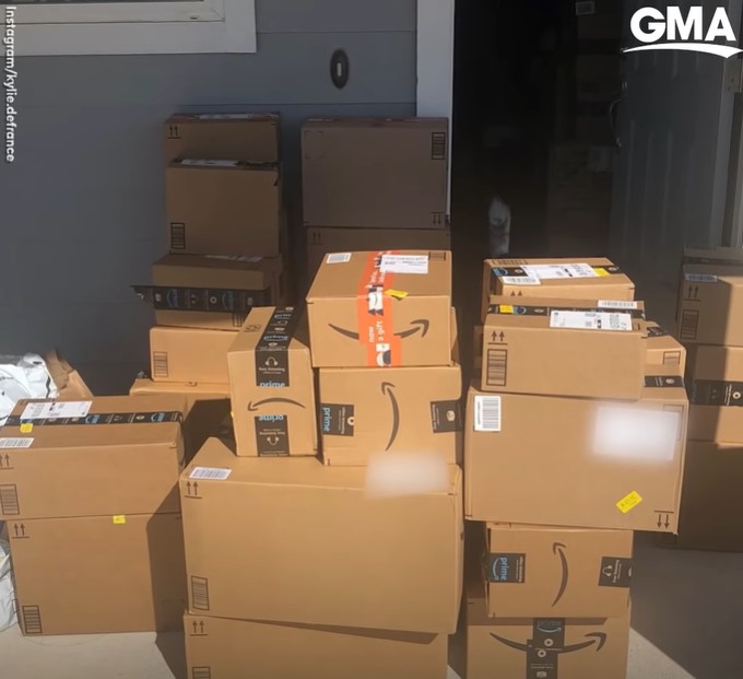 stacks of amazon boxes outside of kylie defrance's home.