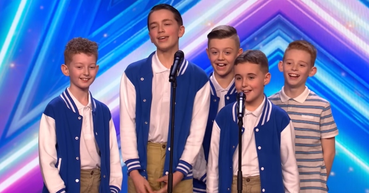 toby-jay, ollie, joey, beau, and adam of the dance group 5 star boys talking on the “britain’s got talent” stage before their audition.