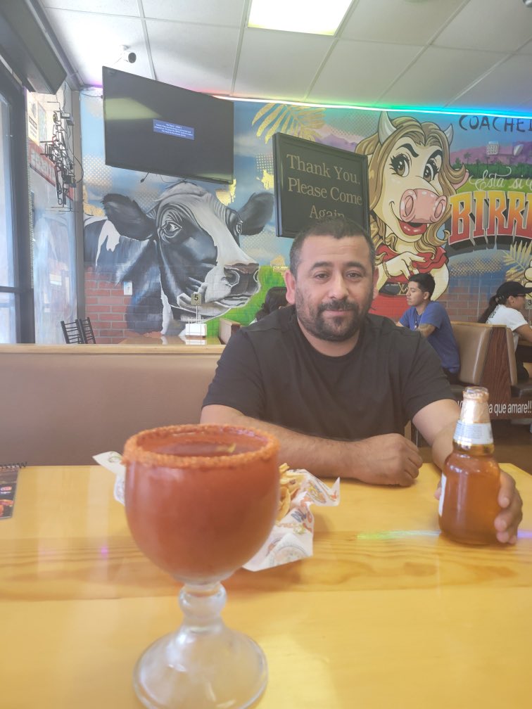 raul and their drinks at a restaurant