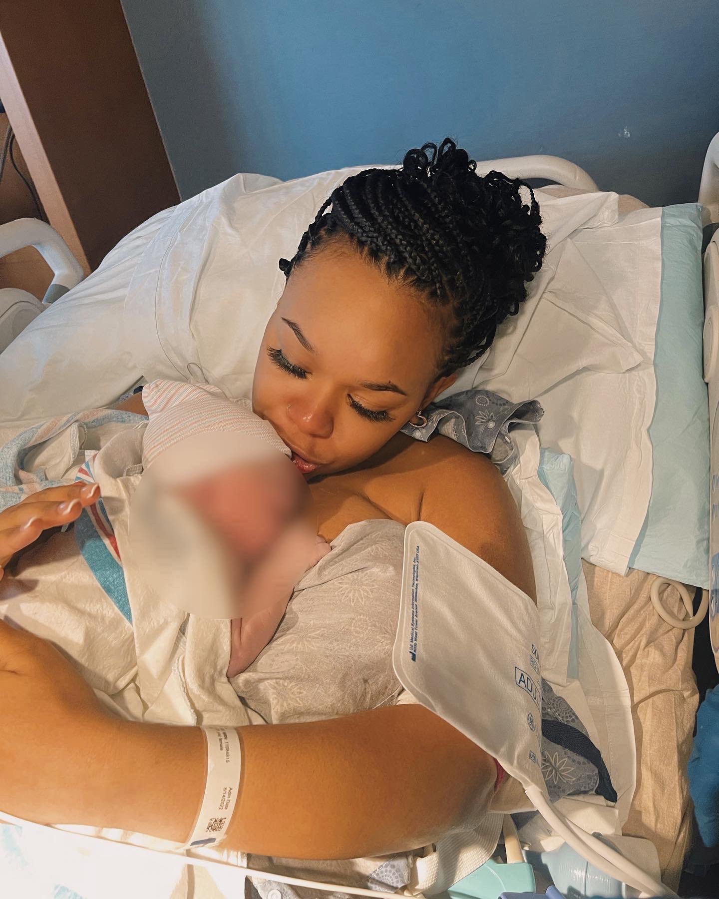 Jada Sayles holding her newborn baby in the hospital