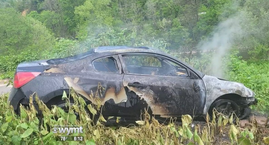 burned car after the fire has been put out.