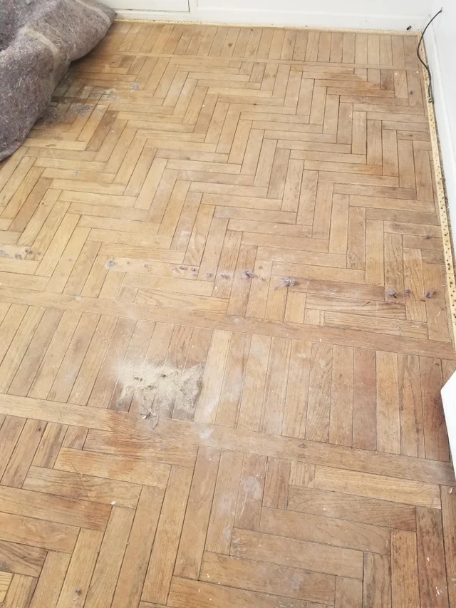antique wood floor with beautiful pattern found underneath a carpet