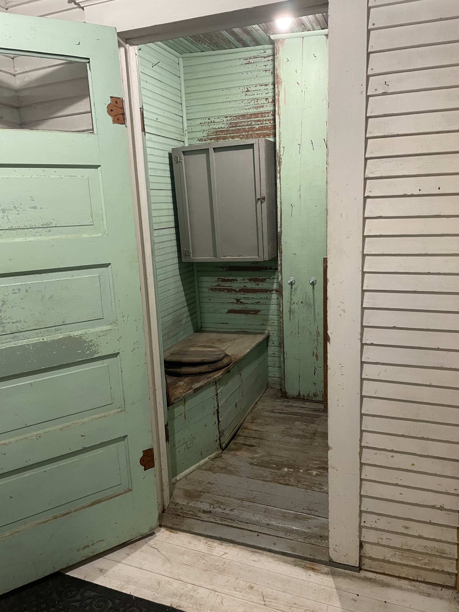 An indoor outhouse in a 1909 home