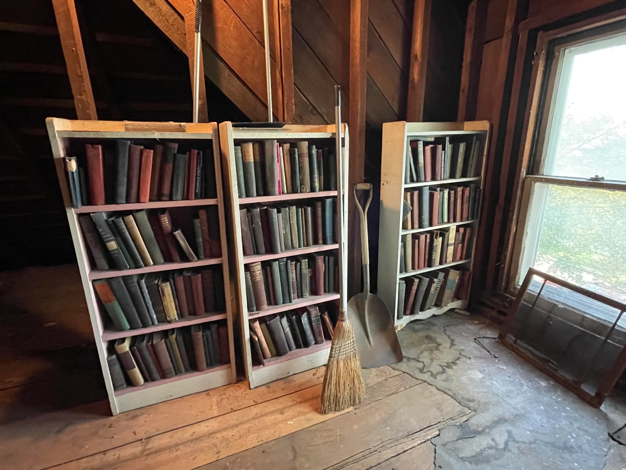 a bookcase full of antique books