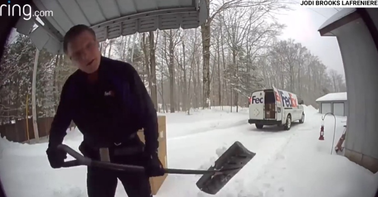 fedex delivery driver mel marlett shoveling the front porch of jodi lafreniere and rodney riesland as seen from their ring front door camera.