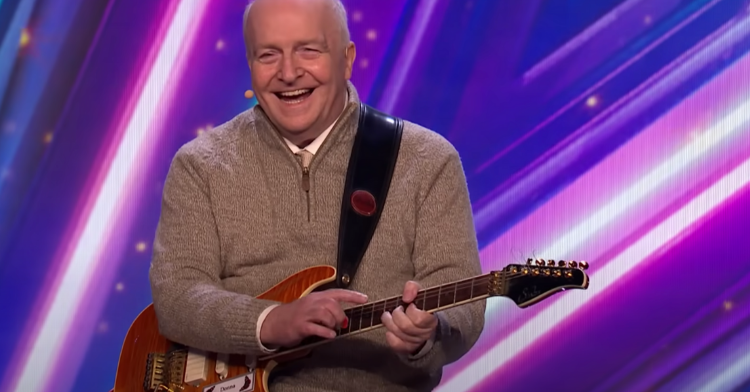 kenny petrie playing the guitar at britain's got talent.