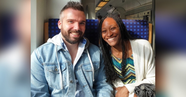 gabriel solberg and krystina burton smiling as they sit next to each other on a plane.