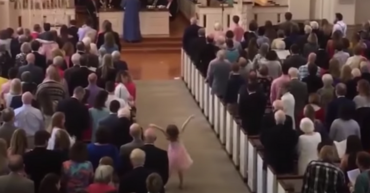 five year old charlotte dancing during an easter service.