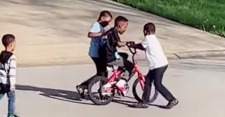 little kids teaching his neighbor Mykel how to ride a bike with no training wheels