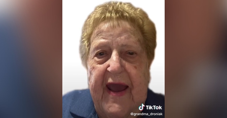 closeup of grandma droniak from tiktok talking in front of a white background.