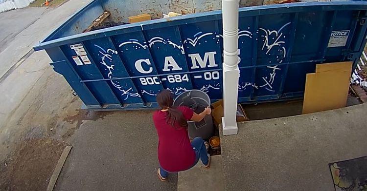 woman helping a squirrel out of a trash can full of water.