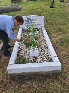 corey working on the neglected grave