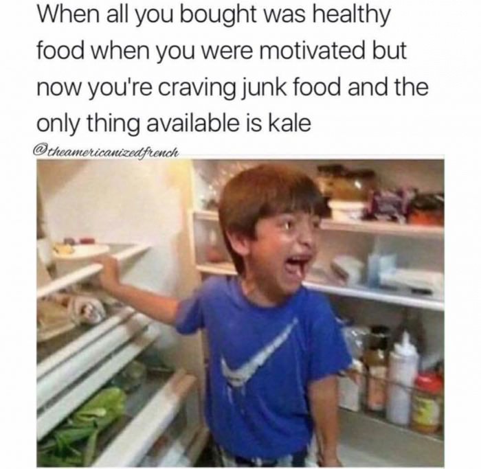 Image of a crying boy in front of an open fridge with the caption "when all you bought was healthy food when you were motivated but now you're craving junk food and the only thing available is kale"