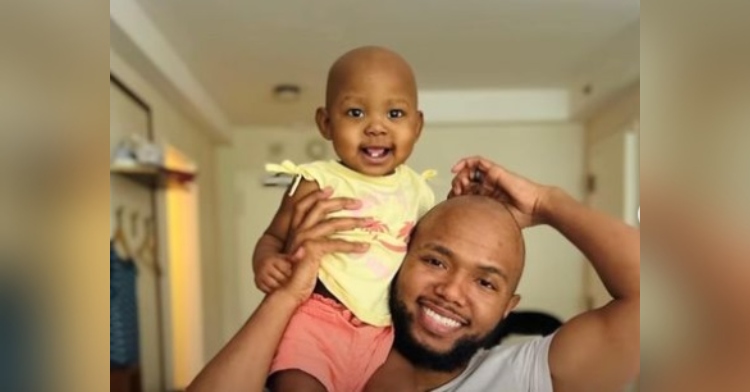 kevin stokes and his baby nova smiling