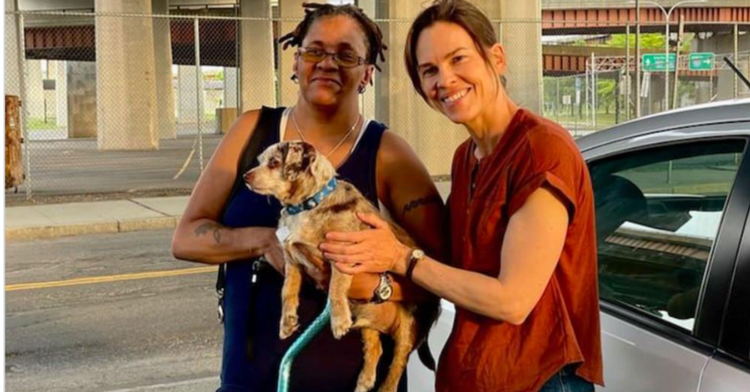 hilary swank and chelsea blackwell holding the lost-and-found dog Blue