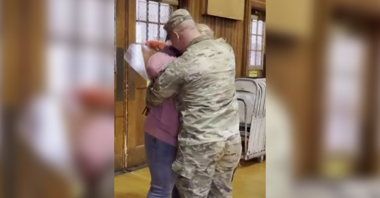 a teacher and her soldier son hugging tight