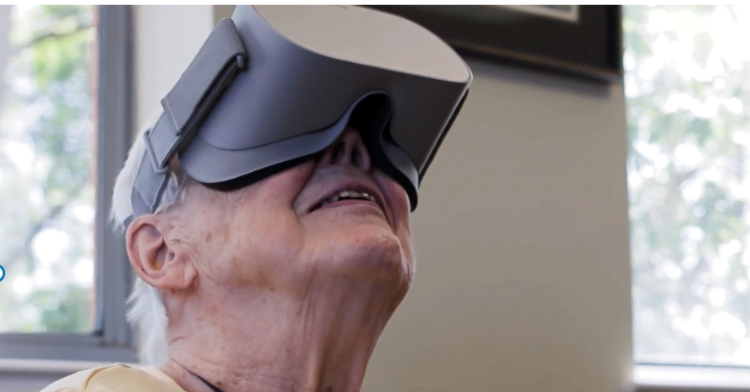 elderly woman having a virtual reality experience.