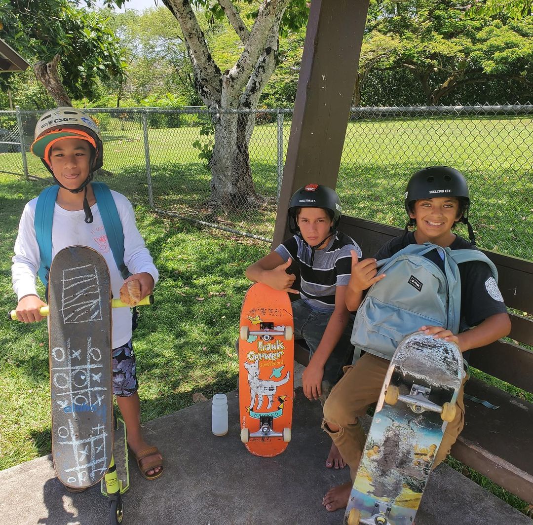 kids holding skateboards