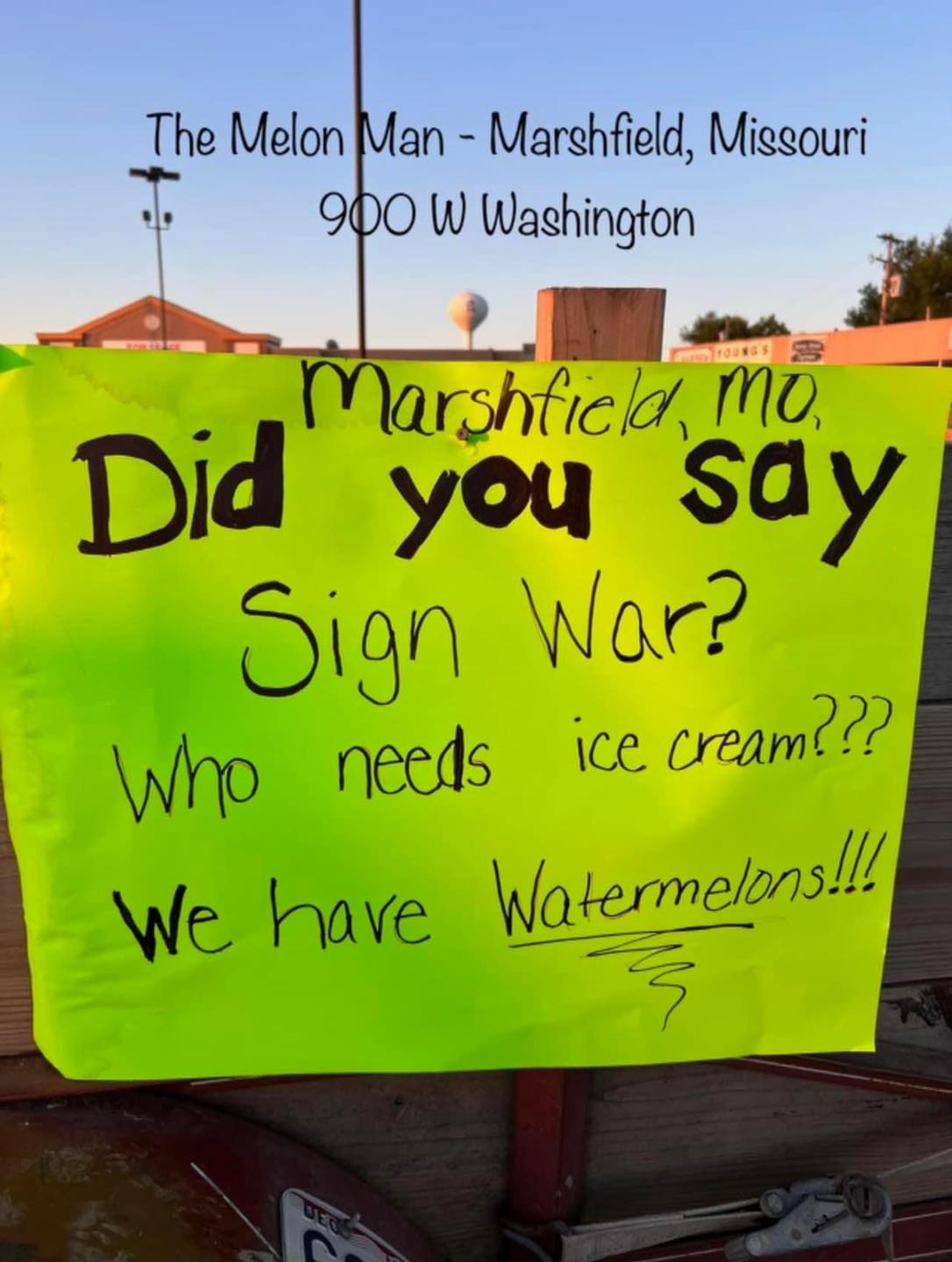 fruit market's sign that says: "sign war? who needs icre cream?? we have watermelons!!"