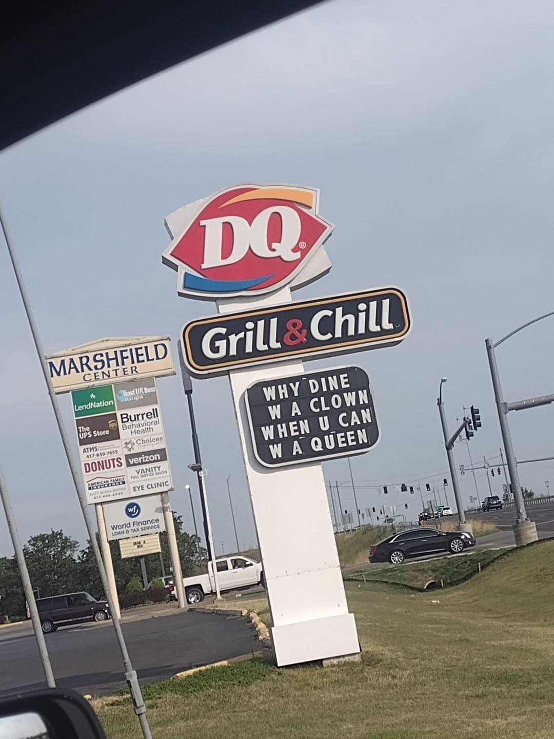 Dq's sign that says "why dine w a clown when u can w a queen."