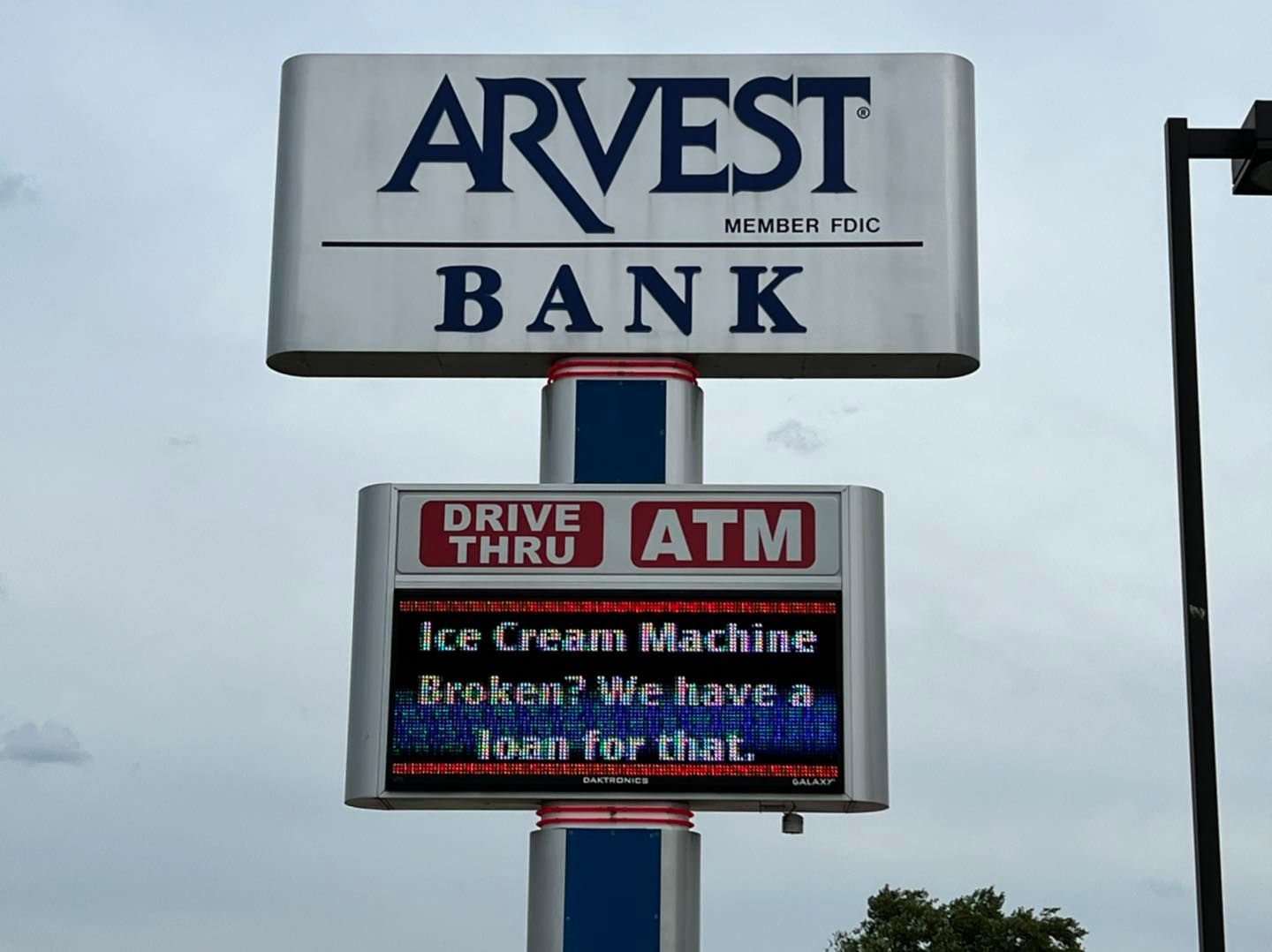 arvest bank sign that says "ice cream machine broken? we have a loan for that."