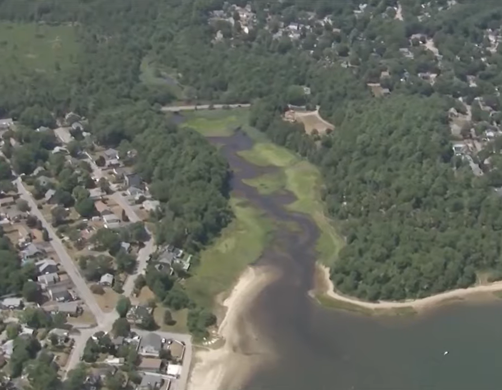 an ariel view of a marshy river in plymouth, massachusetts.