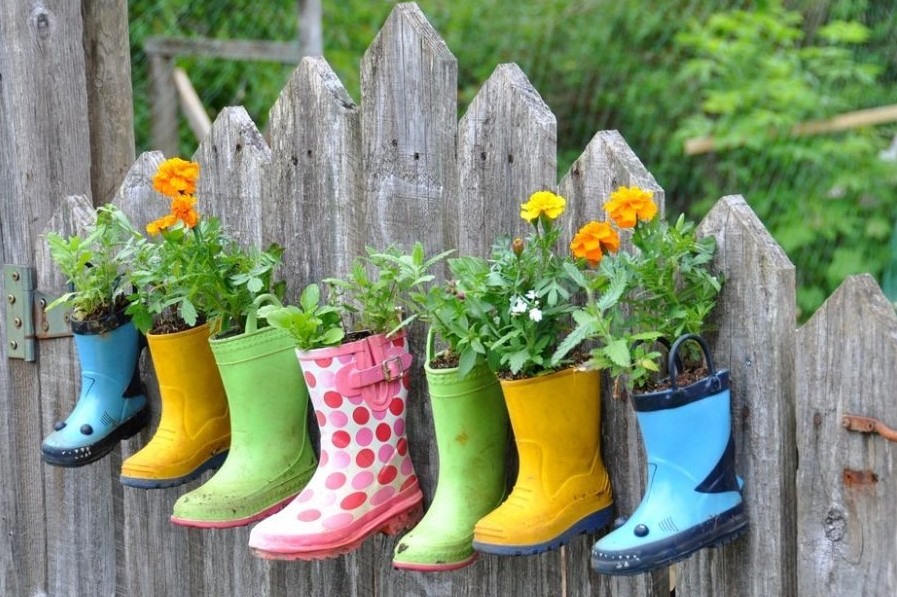 rubber boots with plants in them