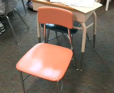 an empty chair in a classroom
