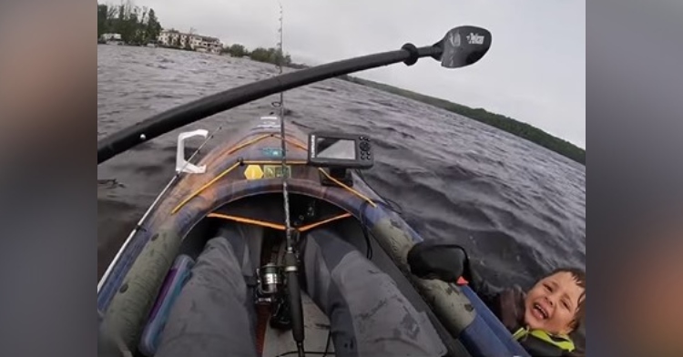 image taken from body cam footage from the perspective of dj jones who was rowing a bow on the river. a 6-year-old boy screams out, terrified as he grabs onto the side of the boat.