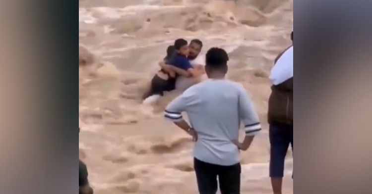 ali bin nasser al wardi rescuing an 8 and 13 year old from a wadi in oman.