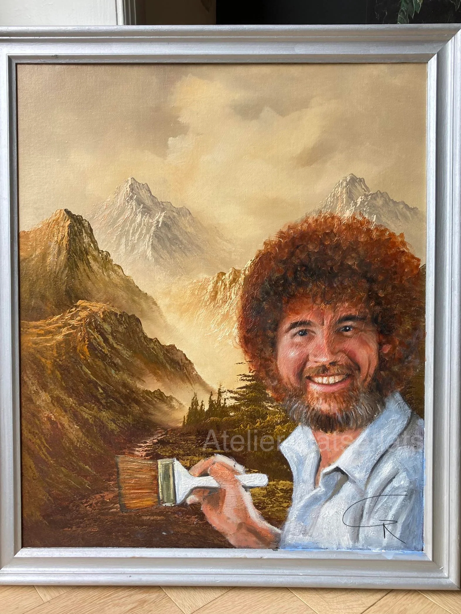 painting of mountains with fog toward the top and a path leading their. bob ross has been added and he's holding a brush, making it look like he's painting the painting he's in.