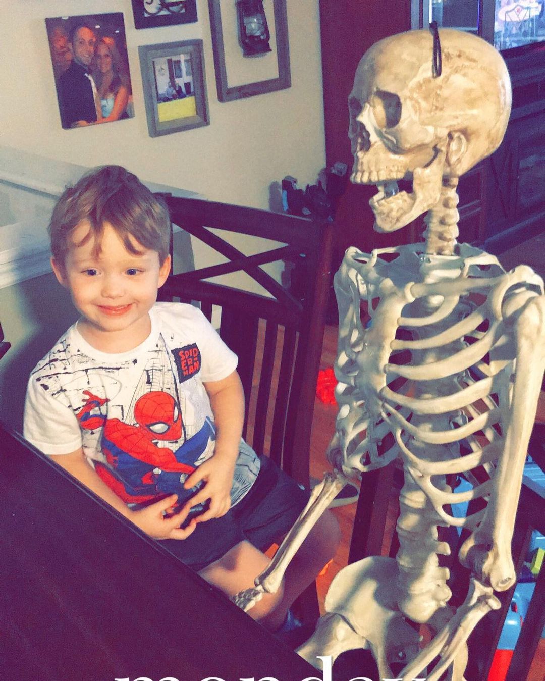 Cole Henderson's son Adrian with Skelly the fake skeleton