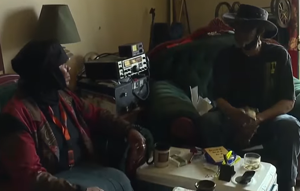 Johnnie "Cowboy" Mayhew and his wife Monica Malik relaxing in their apartment