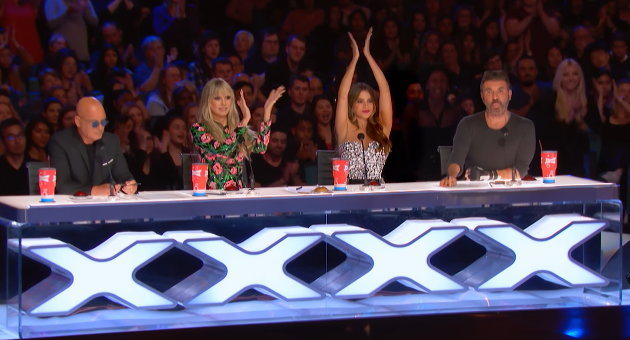 the four judges of agt, with heidi klum and sofia vergara clapping on the air
