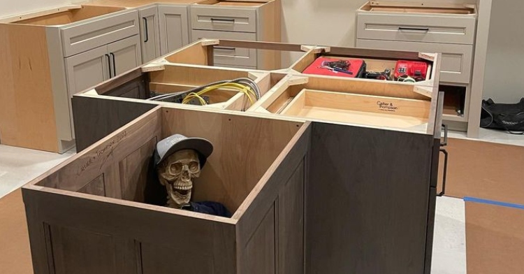 fake skeleton hidden inside kitchen cabinets