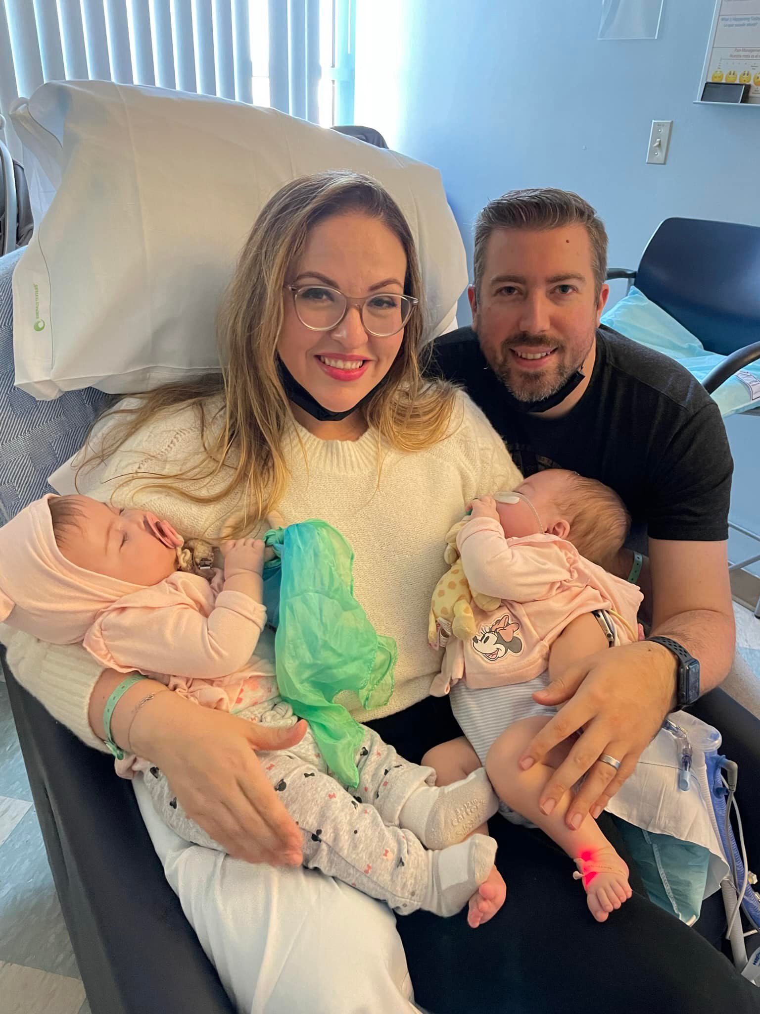 Karla and Joshua Valliere and their twin daughters