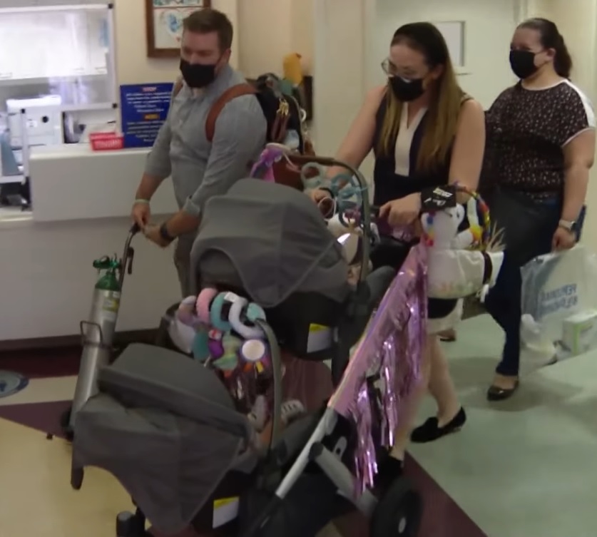 Karla and Joshua Valliere and their twin daughters leave hospital
